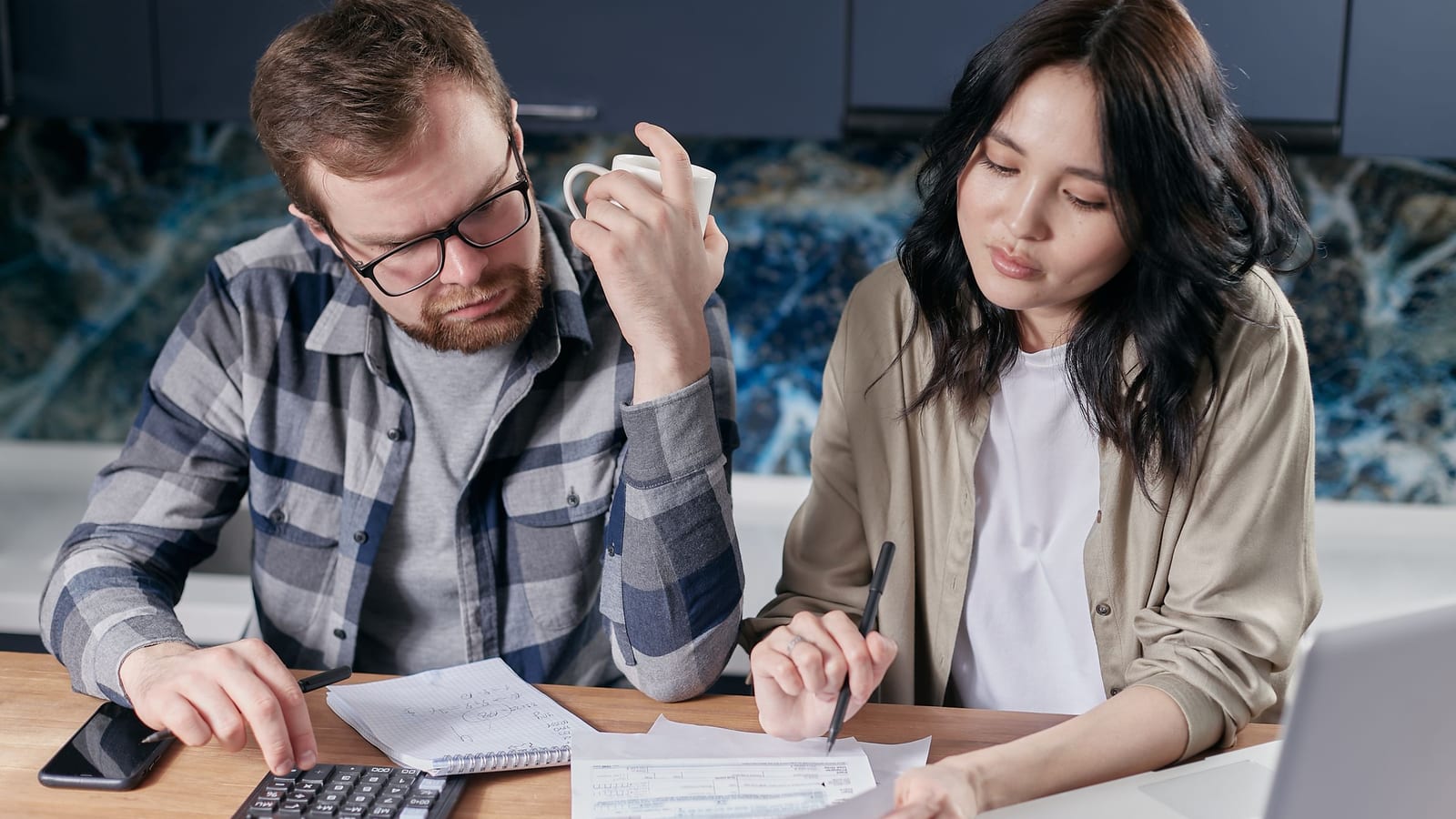 Household gathering pay stubs, tax documents and a laptop to prepare an ACA Marketplace application for 2027
